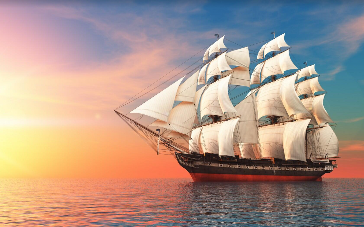 Sejlskib i solopgang/solnedgang