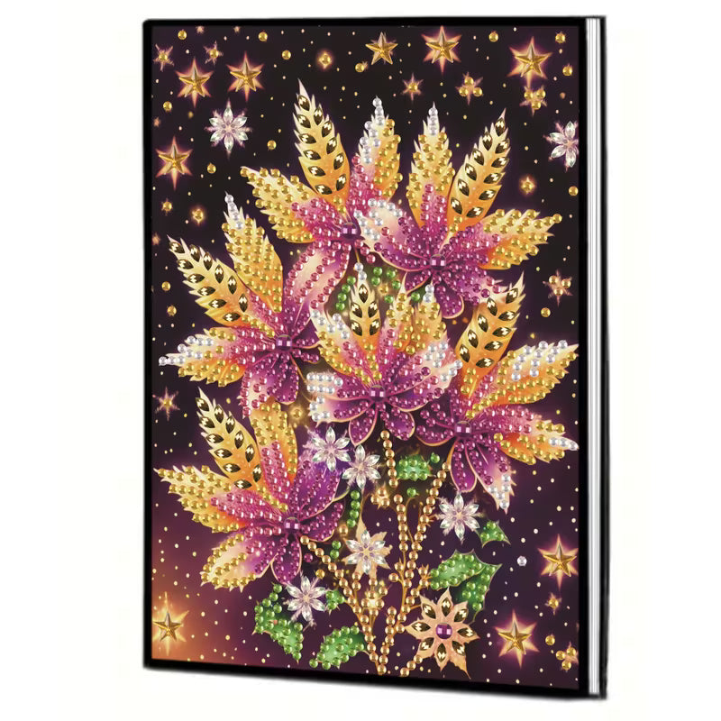 Notesbog med blomster i lilla og gyldne farver. Diamond painting.
