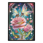 Diamond painting notesbog med lyserøde roser og insekter.