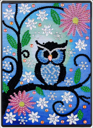 Diamond paint notesbog med ugle og blomster på blå baggrund.