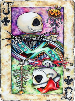 Diamond paint af et spillekort med et et skelet. Den ene side som halloweenpyntet. Den anden side som julepyntet.